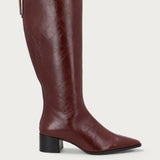 Knee-high heeled boots in burgundy polished leather