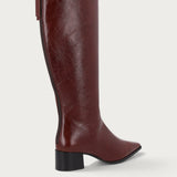 Knee-high heeled boots in burgundy polished leather